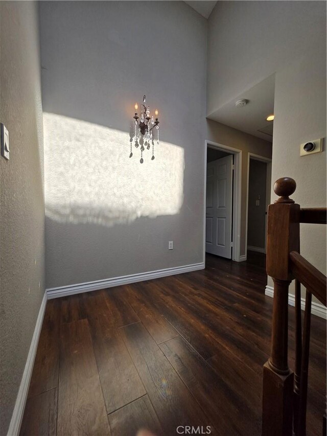 21901 Moneta Ave Unit 21, Carson, CA 90745 - unfurnished dining area with a chandelier and dark wood-style floors