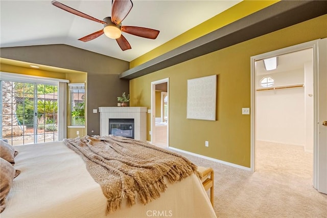 625 Redwing Dr, Merced, CA 95340 - bedroom featuring lofted ceiling, carpet, a walk in closet, a tile fireplace, and baseboards