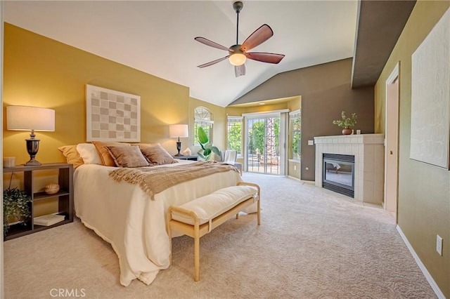 625 Redwing Dr, Merced, CA 95340 - bedroom with access to exterior, light colored carpet, lofted ceiling, a tile fireplace, and baseboards
