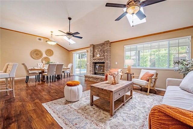 625 Redwing Dr, Merced, CA 95340 - living area featuring ceiling fan, lofted ceiling, wood finished floors, baseboards, and ornamental molding