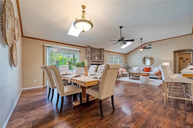 625 Redwing Dr, Merced, CA 95340 - dining space featuring dark wood finished floors, ornamental molding, a ceiling fan, baseboards, and lofted ceiling