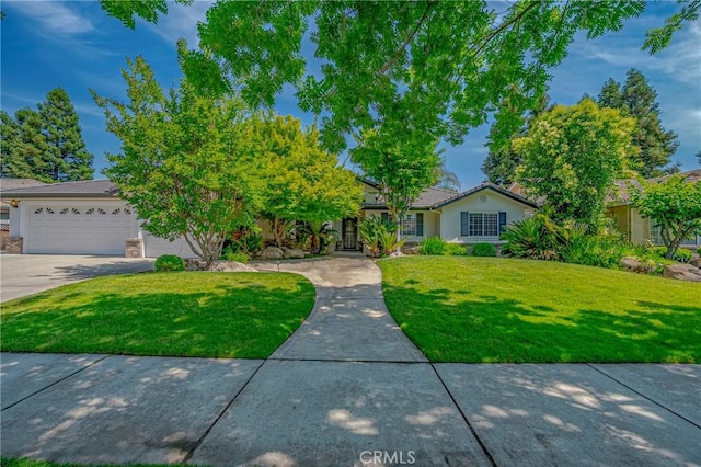625 Redwing Dr, Merced, CA 95340 - view of front of home featuring a front yard, concrete driveway, and a garage