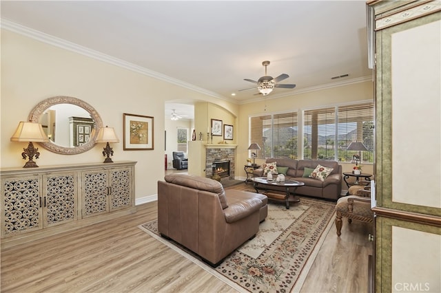 23463 Canterbury Way, Murrieta, CA 92562 - living area featuring a ceiling fan, a fireplace, light wood-type flooring, ornamental molding, and baseboards