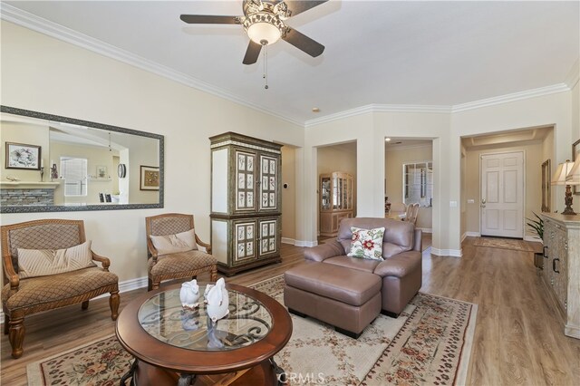 23463 Canterbury Way, Murrieta, CA 92562 - living room with ceiling fan, crown molding, wood finished floors, and baseboards