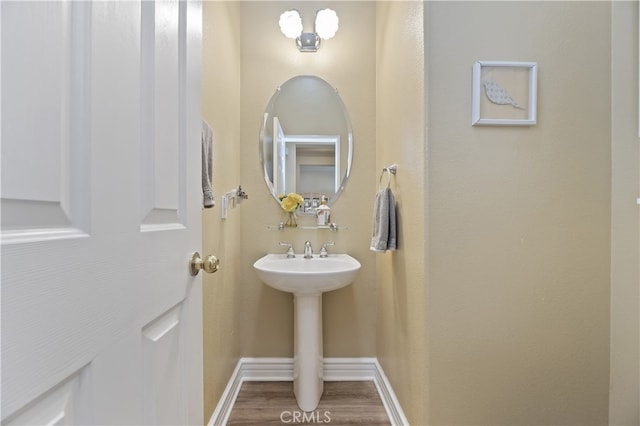 23463 Canterbury Way, Murrieta, CA 92562 - bathroom featuring wood finished floors, baseboards, and a sink