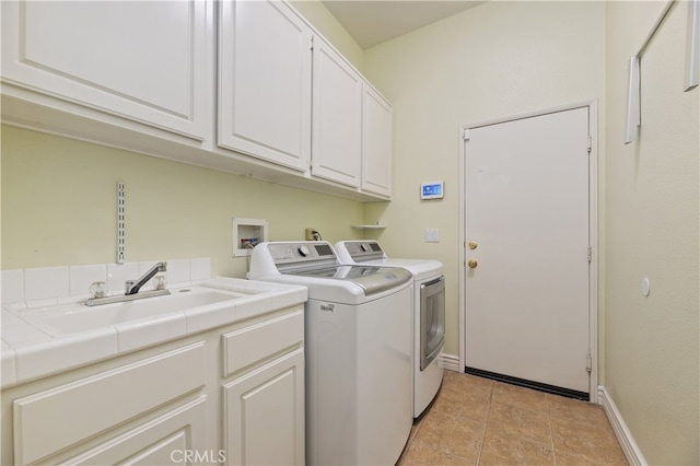 23463 Canterbury Way, Murrieta, CA 92562 - laundry room with cabinet space, washing machine and clothes dryer, baseboards, and light tile patterned floors