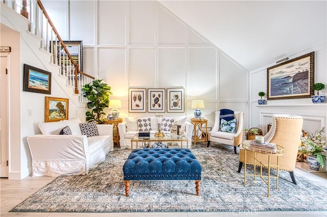 25536 Rue Terrase Unit 17, Laguna Niguel, CA 92677 - living room featuring a decorative wall, stairway, high vaulted ceiling, and wood finished floors
