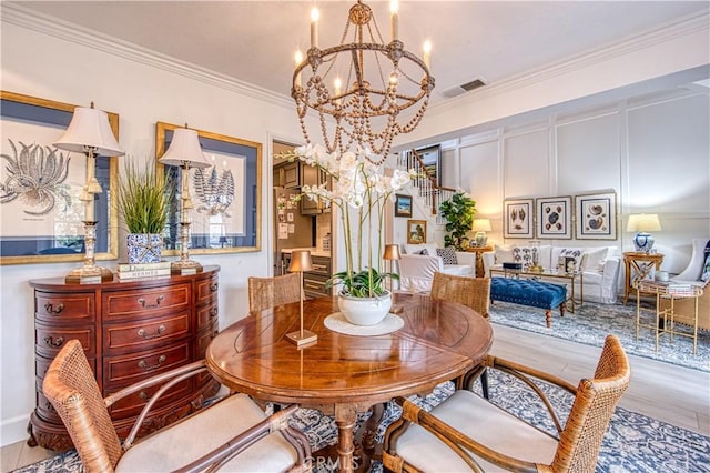 25536 Rue Terrase Unit 17, Laguna Niguel, CA 92677 - dining room featuring a chandelier, crown molding, and wood finished floors