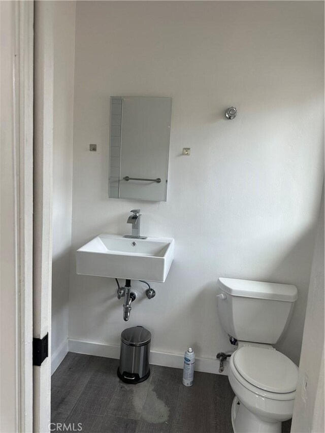 45208 17th St W, Lancaster, CA 93534 - bathroom with toilet and wood finished floors