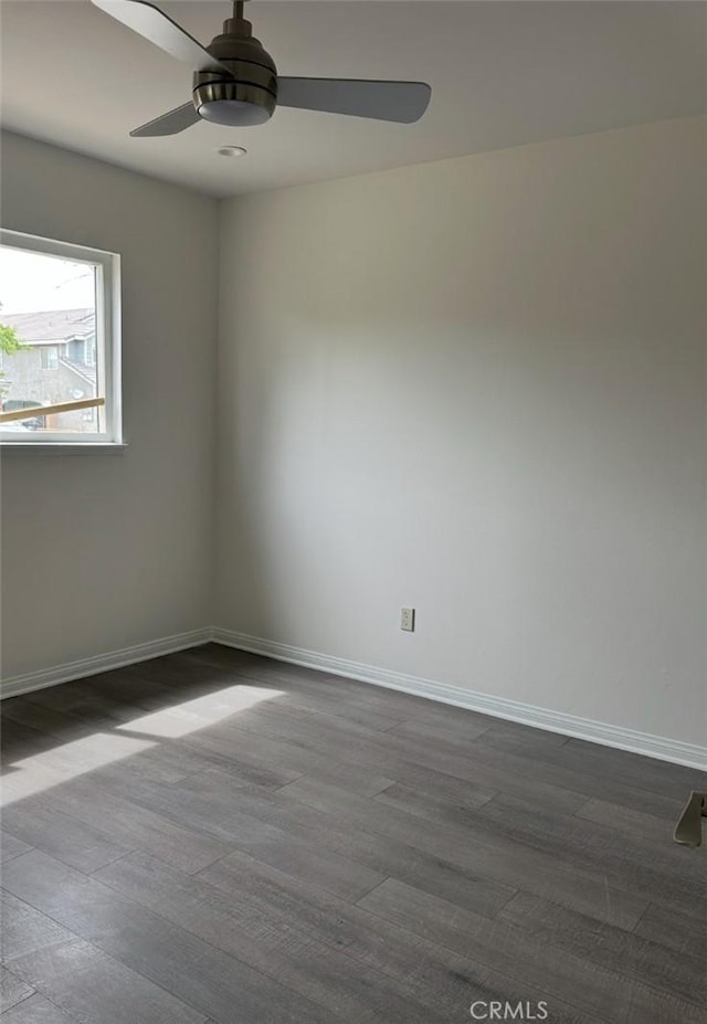45208 17th St W, Lancaster, CA 93534 - unfurnished room featuring a ceiling fan, baseboards, and dark wood finished floors