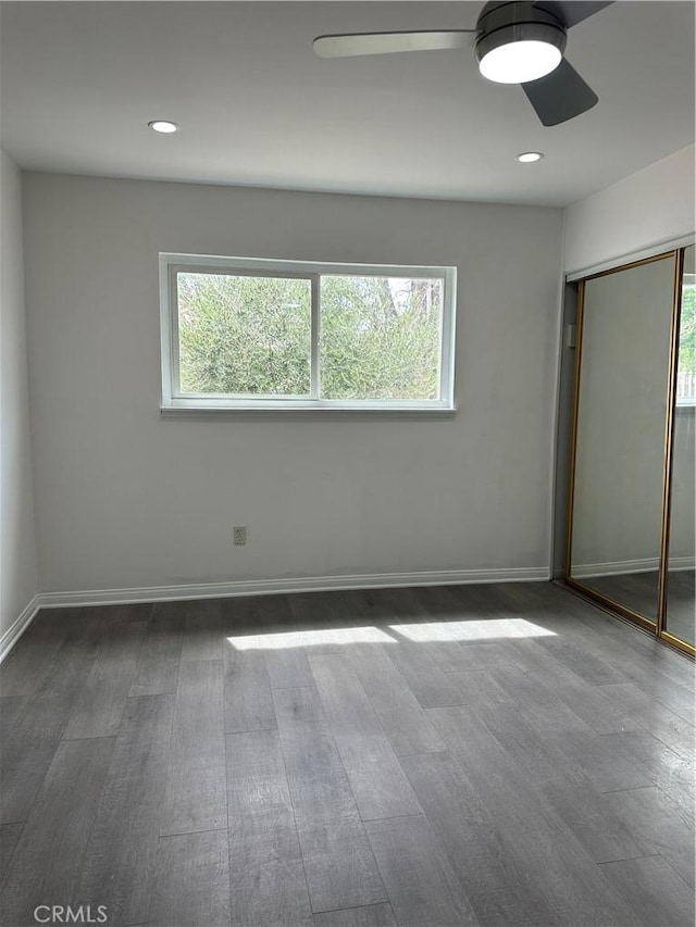 45208 17th St W, Lancaster, CA 93534 - unfurnished bedroom featuring wood finished floors, multiple windows, baseboards, and recessed lighting