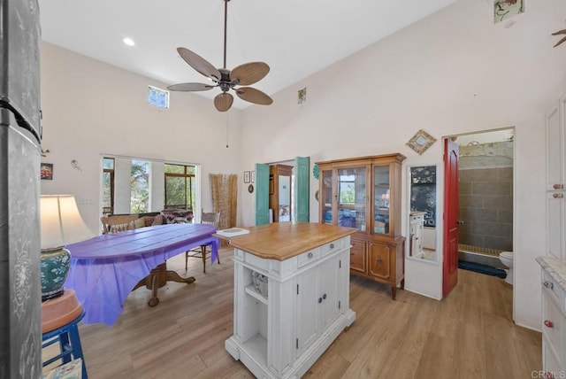 2620 Mar Vinga, Fallbrook, CA 92028 - kitchen with white cabinetry, a ceiling fan, light wood finished floors, open shelves, and a high ceiling