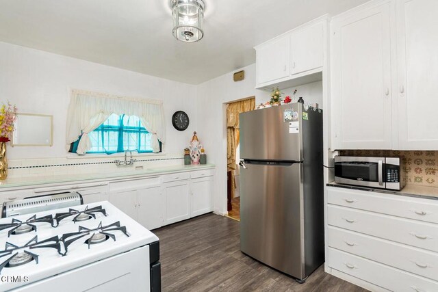 3247 La Clede Ave, Los Angeles, CA 90039 - kitchen with stainless steel appliances, light countertops, and white cabinetry