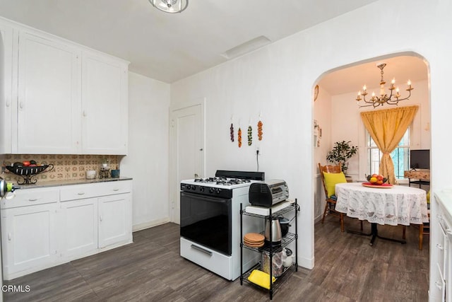 3247 La Clede Ave, Los Angeles, CA 90039 - kitchen featuring white range with gas stovetop, arched walkways, a chandelier, and dark wood-style floors