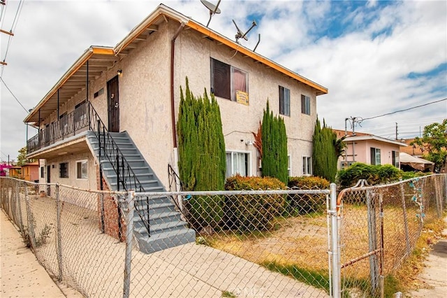 333 W D St, Wilmington, CA 90744 - view of front of house featuring stucco siding and stairs