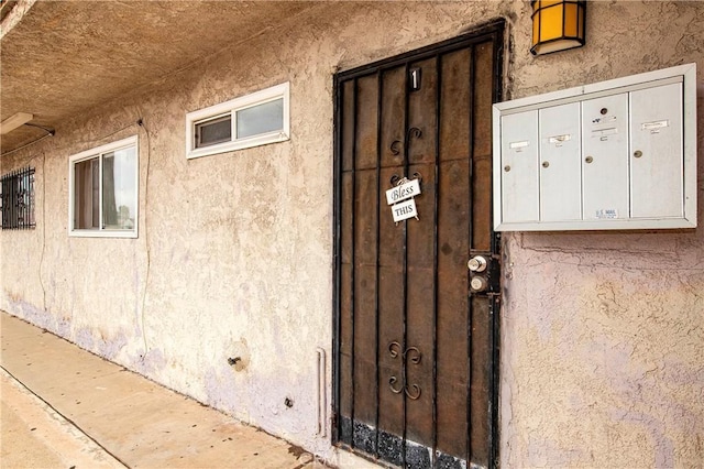 333 W D St, Wilmington, CA 90744 - doorway to property featuring stucco siding