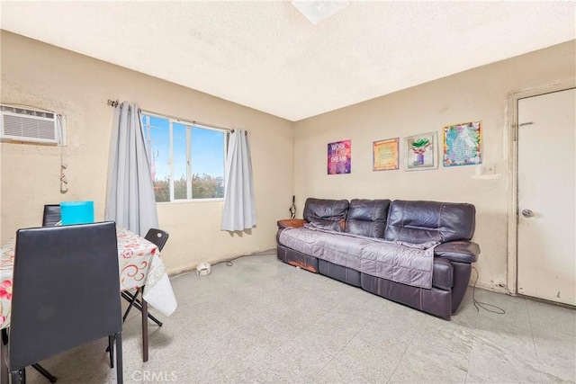 333 W D St, Wilmington, CA 90744 - living room with a wall mounted air conditioner and a textured ceiling