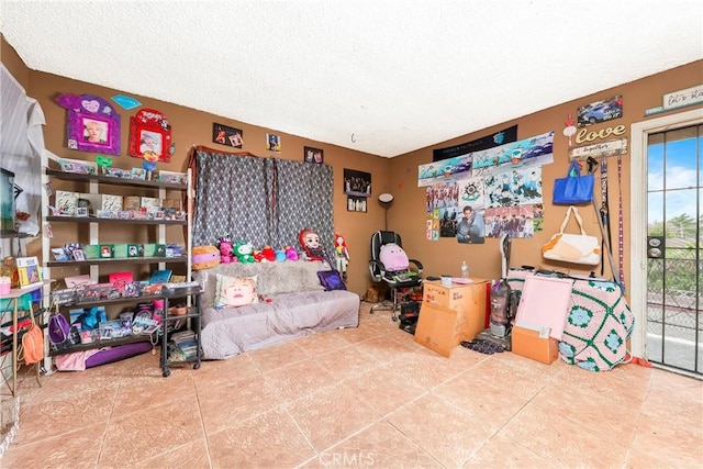 333 W D St, Wilmington, CA 90744 - living room featuring tile patterned floors and a textured ceiling