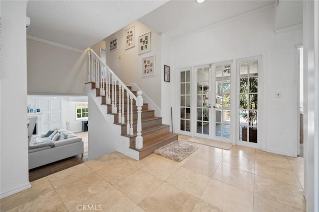 4420 Conchita Way, Tarzana, CA 91356 - entrance foyer with french doors, ornamental molding, stairs, tile patterned flooring, and baseboards