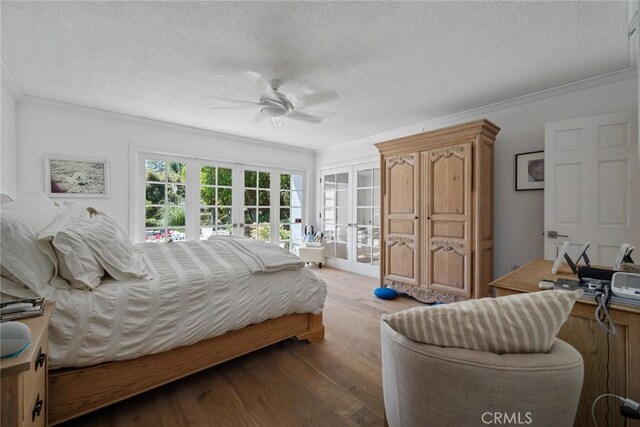 4420 Conchita Way, Tarzana, CA 91356 - bedroom featuring french doors, access to outside, crown molding, a textured ceiling, and wood finished floors