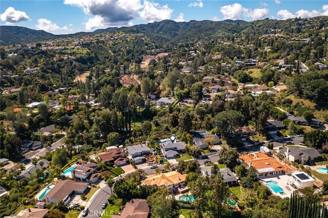 4420 Conchita Way, Tarzana, CA 91356 - aerial view of property's location featuring a mountainous background, a pool, and nearby suburban area