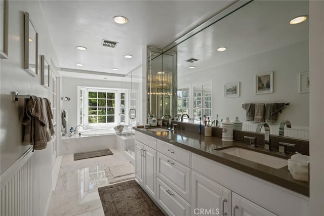 4420 Conchita Way, Tarzana, CA 91356 - full bath with a bath, marble tiled floors, double vanity, recessed lighting, and wainscoting