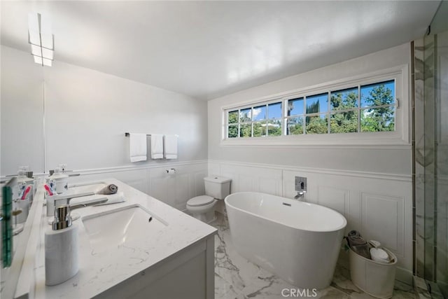 4420 Conchita Way, Tarzana, CA 91356 - full bathroom featuring marble tiled floors, double vanity, wainscoting, a soaking tub, and a decorative wall