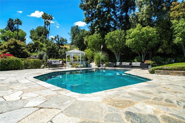 4420 Conchita Way, Tarzana, CA 91356 - outdoor pool featuring outdoor lounge area, a gazebo, a patio, and view of scattered trees