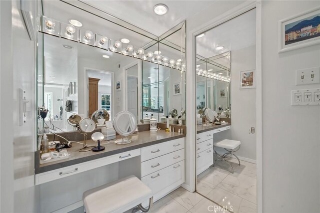 4420 Conchita Way, Tarzana, CA 91356 - bathroom with marble look tiles and vanity
