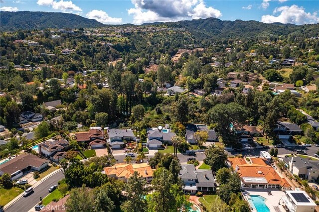 4420 Conchita Way, Tarzana, CA 91356 - aerial view of property's location with a mountain backdrop, nearby suburban area, and a pool