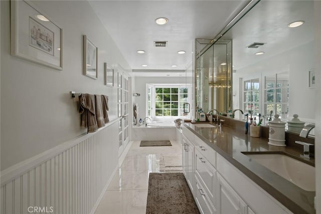 4420 Conchita Way, Tarzana, CA 91356 - bathroom featuring a bath, double vanity, a shower stall, marble tiled flooring, and french doors