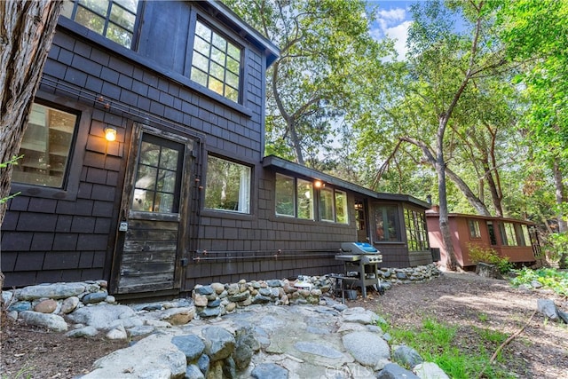25 Hot Spring Canyon Rd, San Juan Capistrano, CA 92675 - view of home's exterior with a sunroom