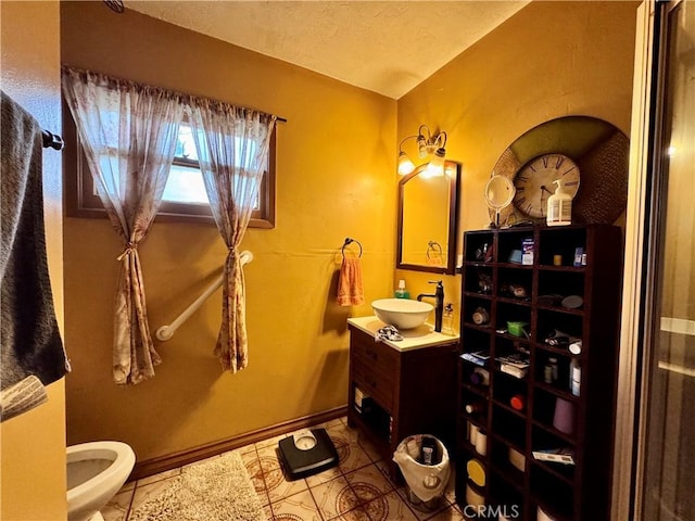 9547 Marion Ave, Montclair, CA 91763 - bathroom featuring vanity, toilet, tile patterned floors, and baseboards