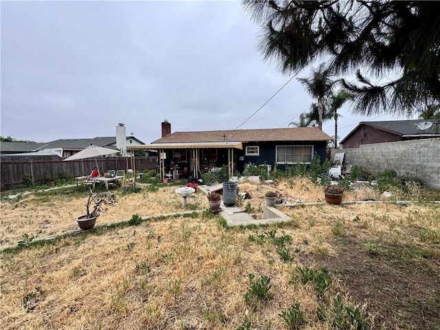 9547 Marion Ave, Montclair, CA 91763 - rear view of property featuring a chimney