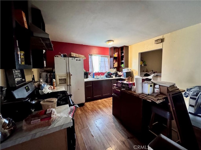 9547 Marion Ave, Montclair, CA 91763 - kitchen with white refrigerator with ice dispenser, light wood-style floors, light countertops, and a sink