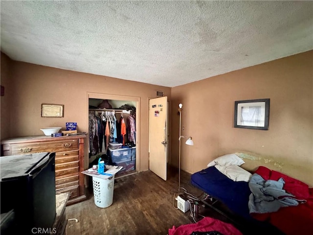 9547 Marion Ave, Montclair, CA 91763 - bedroom featuring wood finished floors, a textured ceiling, and a closet