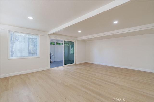 8235 Coleman St, Riverside, CA 92504 - empty room with healthy amount of natural light, light wood-style flooring, beam ceiling, baseboards, and recessed lighting