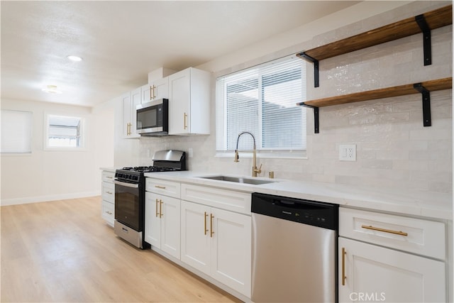 8235 Coleman St, Riverside, CA 92504 - kitchen with appliances with stainless steel finishes, open shelves, decorative backsplash, a sink, and recessed lighting