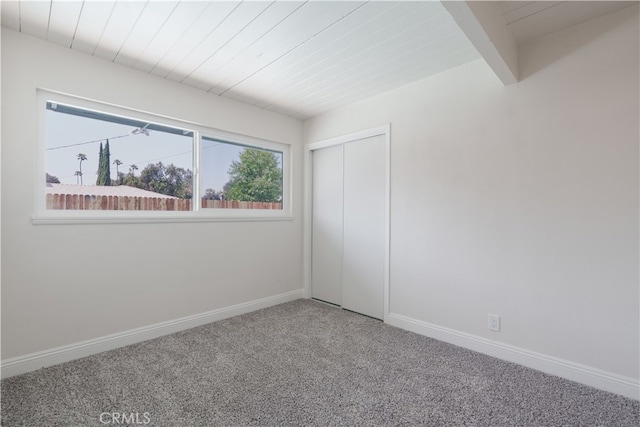 8235 Coleman St, Riverside, CA 92504 - carpeted empty room with baseboards and wood ceiling