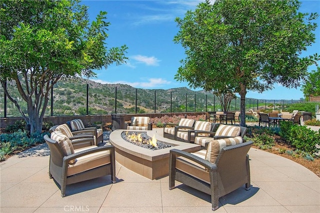147 Luneta Ln, Rancho Mission Viejo, CA 92694 - view of patio / terrace with a mountain view, an outdoor living space with a fire pit, and outdoor dining space