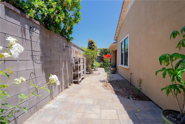 147 Luneta Ln, Rancho Mission Viejo, CA 92694 - view of home's exterior featuring stucco siding, a fenced backyard, and a patio