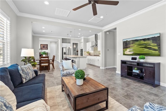 147 Luneta Ln, Rancho Mission Viejo, CA 92694 - living area featuring ceiling fan, recessed lighting, baseboards, and crown molding
