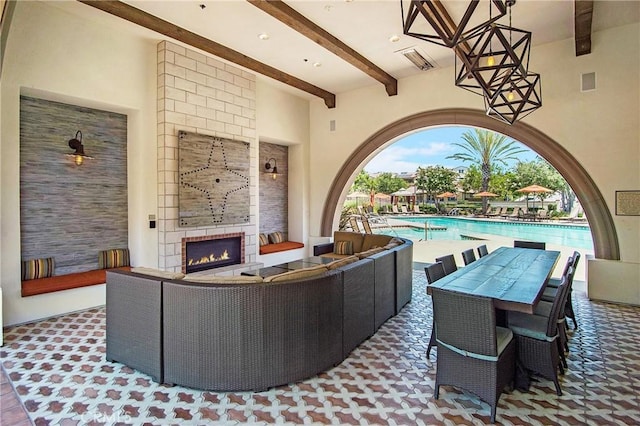 147 Luneta Ln, Rancho Mission Viejo, CA 92694 - view of patio with an outdoor living space with a fireplace, a community pool, and outdoor dining space