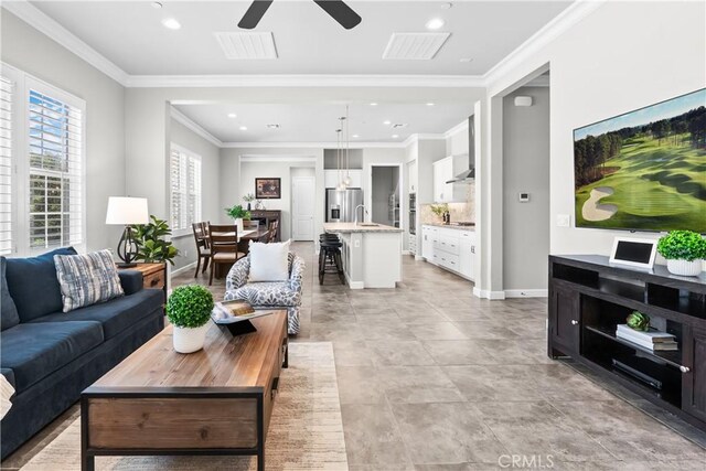 147 Luneta Ln, Rancho Mission Viejo, CA 92694 - living area featuring a ceiling fan, recessed lighting, baseboards, and ornamental molding