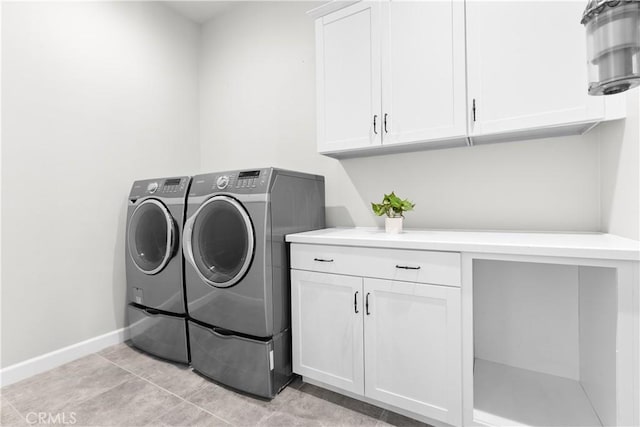 147 Luneta Ln, Rancho Mission Viejo, CA 92694 - washroom with cabinet space, washing machine and dryer, baseboards, and light tile patterned floors