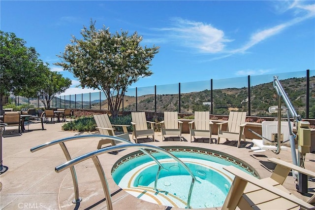 147 Luneta Ln, Rancho Mission Viejo, CA 92694 - view of swimming pool with a community hot tub, a mountain view, and a patio area