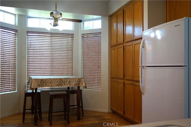2068 Spy Glass Ct, Merced, CA 95340 - dining space with ceiling fan, light wood-type flooring, and baseboards