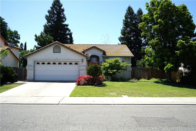 2068 Spy Glass Ct, Merced, CA 95340 - view of front facade featuring a tiled roof, stucco siding, a garage, and driveway
