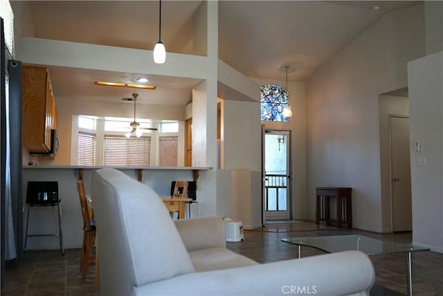 2068 Spy Glass Ct, Merced, CA 95340 - living area with lofted ceiling and baseboards