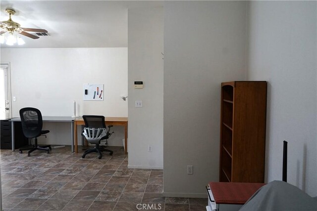 2068 Spy Glass Ct, Merced, CA 95340 - home office featuring ceiling fan, dark stone finish floors, and baseboards